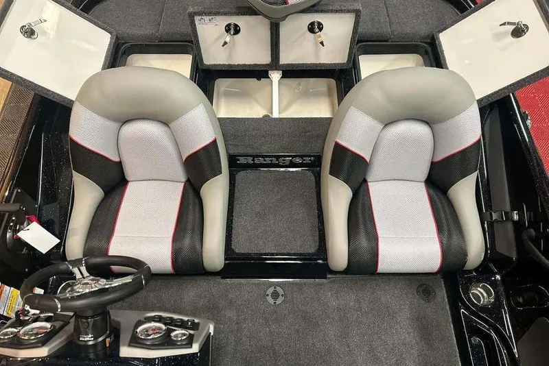 Slide: The Image of 2026 Ranger Z185 boat interior with dual seats and steering console. - 12