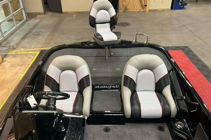 Slide: The Image of 2026 Ranger Z185 boat interior with three cushioned seats in a showroom. - 13