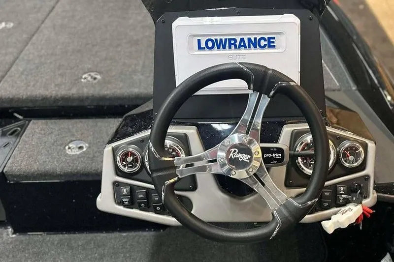 Slide: The Image of 2026 Ranger Z185 boat dashboard with Lowrance Elite display and steering wheel. - 4