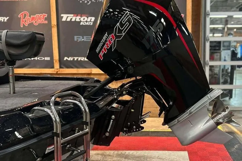 Slide: The Image of 2026 Ranger Z185 boat with Mercury Pro XS engine displayed indoors. - 6