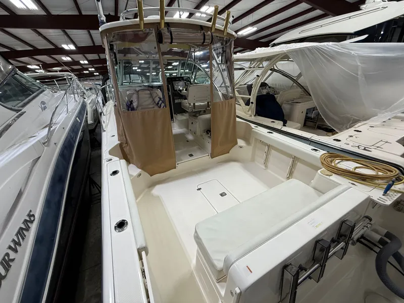 Slide: The Image of 2008 Pursuit OS 285 Offshore in a boat storage facility. - 2