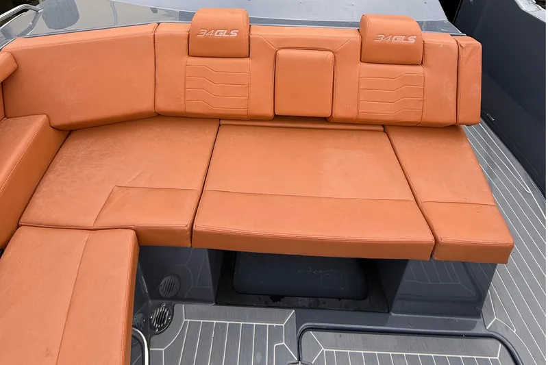 Slide: The Image of 2023 Cruisers Yachts 34 GLS OB boat with orange cushioned seating. - 13