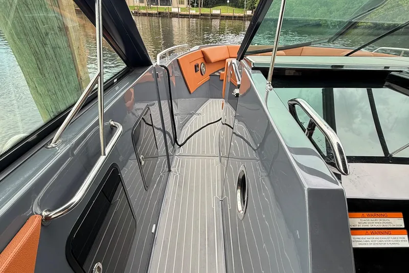 Slide: The Image of 2023 Cruisers Yachts 34 GLS OB boat deck with sleek design and modern features. - 16