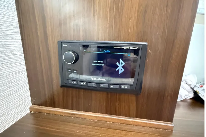 Slide: The Image of 2023 Cruisers Yachts 34 GLS OB cabin Bluetooth stereo system display. - 26