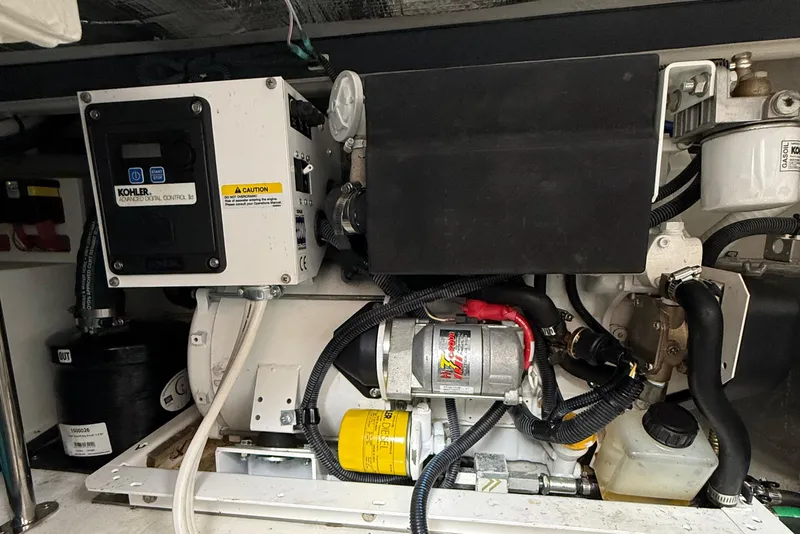 Slide: The Image of Engine compartment of 2023 Cruisers Yachts 34 GLS OB with Kohler generator. - 33