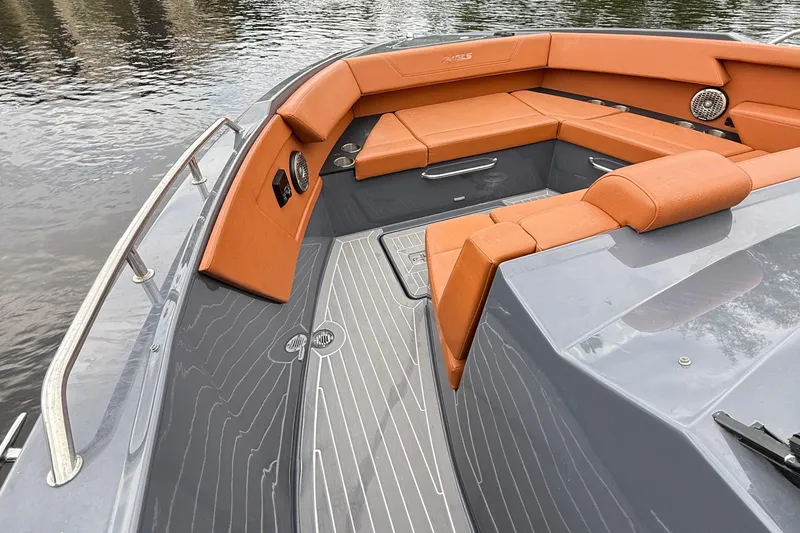 Slide: The Image of 2023 Cruisers Yachts 34 GLS OB boat with orange seating and sleek gray deck. - 15