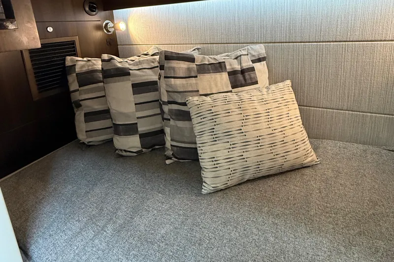 Slide: The Image of Cozy interior cabin of 2023 Cruisers Yachts 34 GLS OB with decorative pillows. - 27