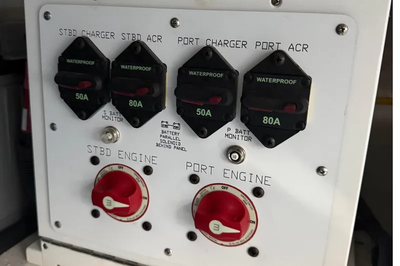Slide: The Image of Electrical panel of 2023 Cruisers Yachts 34 GLS OB with waterproof switches and engine controls. - 32