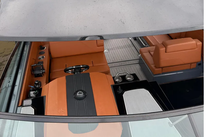 Slide: The Image of 2023 Cruisers Yachts 34 GLS OB interior with luxurious seating and modern controls. - 9