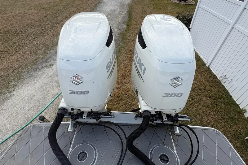 Slide: The Image of Twin Suzuki 300 outboard engines on a 2006 Bluewater 2850 CC boat. - 5