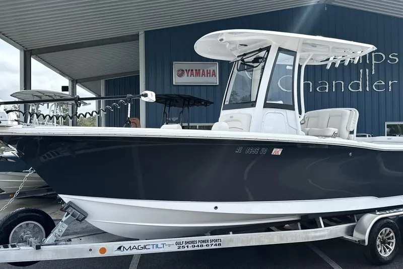 The Image of 2026 Sea Hunt Ultra 245 SE boat on trailer at dealership. - 0