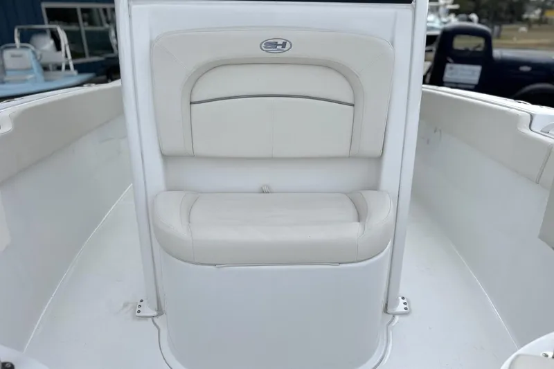Slide: The Image of 2026 Sea Hunt Ultra 245 SE boat interior with cushioned seating. - 10