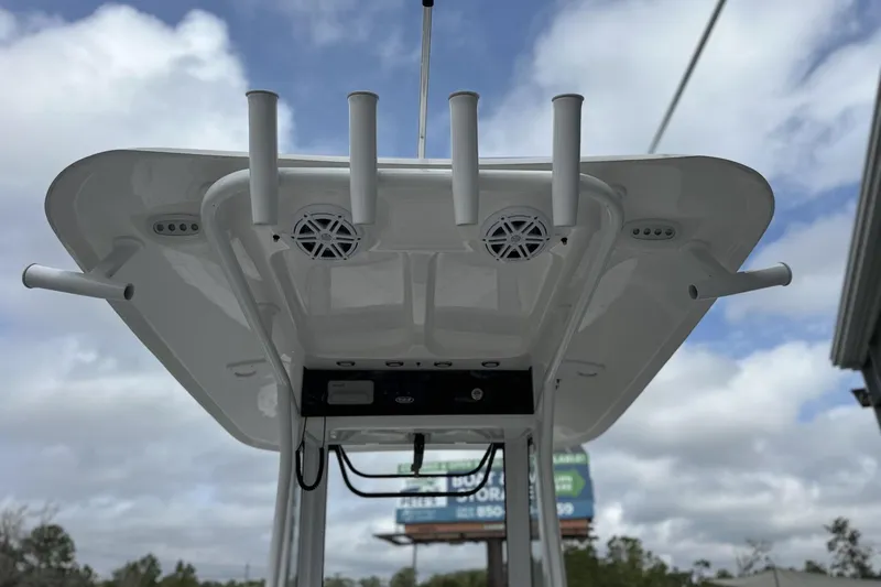 Slide: The Image of 2026 Sea Hunt Ultra 245 SE boat top view with rod holders and speakers. - 13