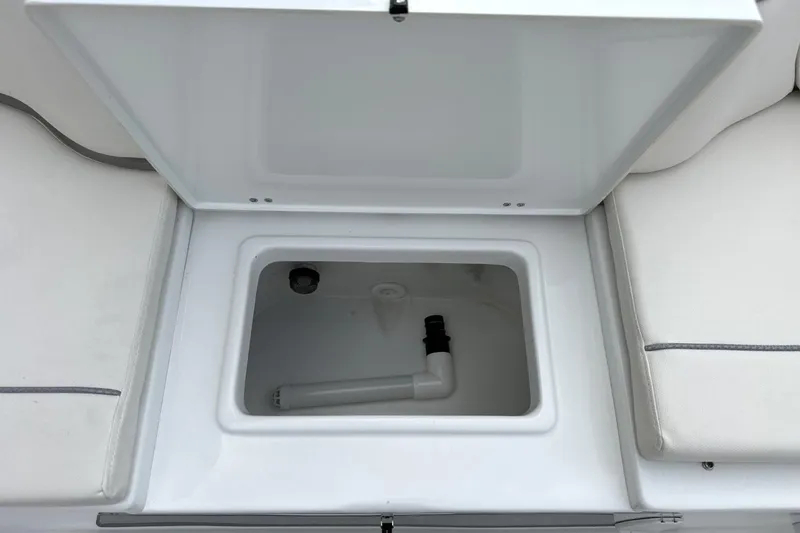 Slide: The Image of Open storage compartment on 2026 Sea Hunt Ultra 245 SE boat. - 18