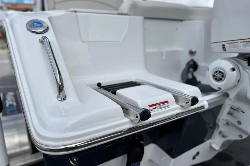 Slide: The Image of 2026 Sea Hunt Ultra 245 SE boat swim platform with ladder and stainless steel handle. - 20