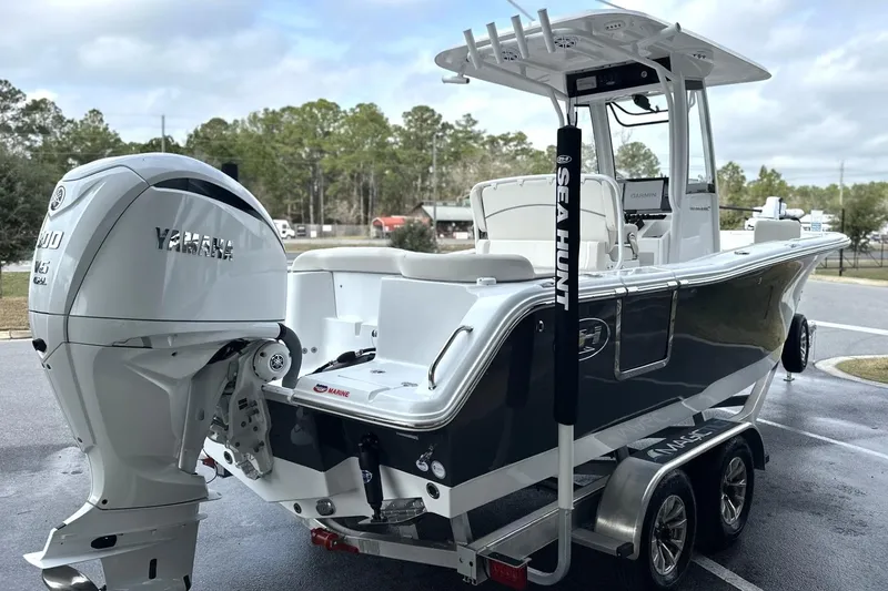 Slide: The Image of 2026 Sea Hunt Ultra 245 SE boat with Yamaha engine on trailer. - 26