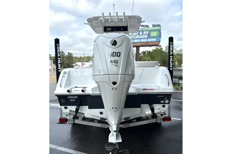 Slide: The Image of 2026 Sea Hunt Ultra 245 SE boat with powerful 300 V6 engine, rear view. - 27