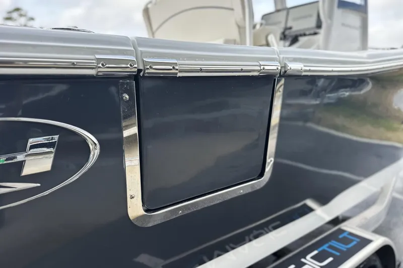 Slide: The Image of 2026 Sea Hunt Ultra 245 SE boat detail with sleek chrome accents. - 28