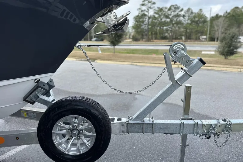 Slide: The Image of 2026 Sea Hunt Ultra 245 SE boat trailer with wheel and hitch detail. - 30