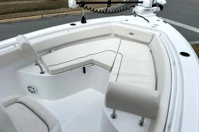 Slide: The Image of 2026 Sea Hunt Ultra 245 SE boat interior with cushioned seating and modern design. - 9