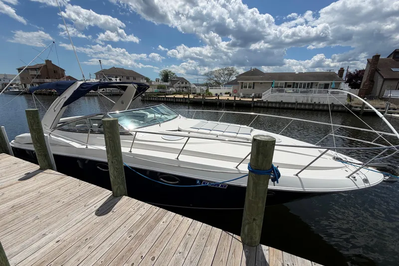 Slide: The Image of 2006 Monterey 350 Sport Yacht docked at a marina under a partly cloudy sky. - 20