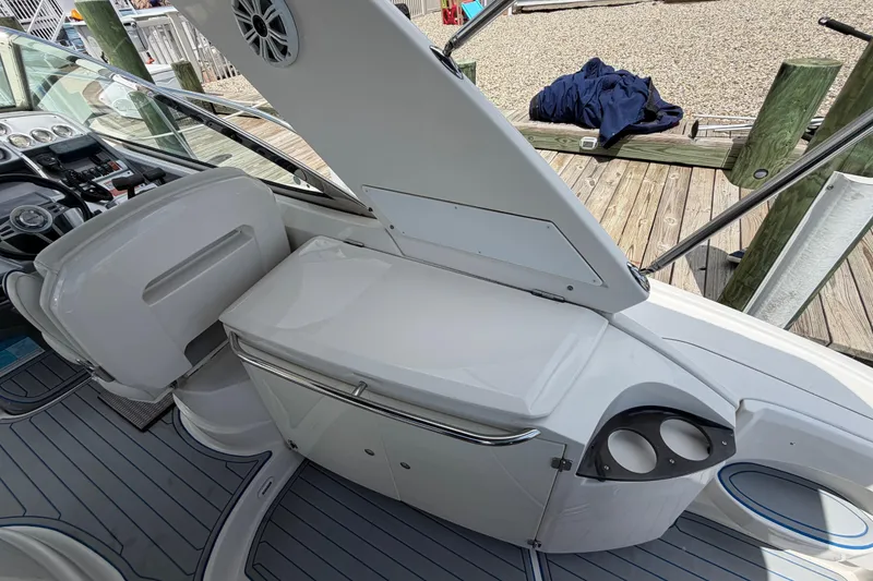 Slide: The Image of 2006 Monterey 350 Sport Yacht interior with helm, seating, and storage area. - 27