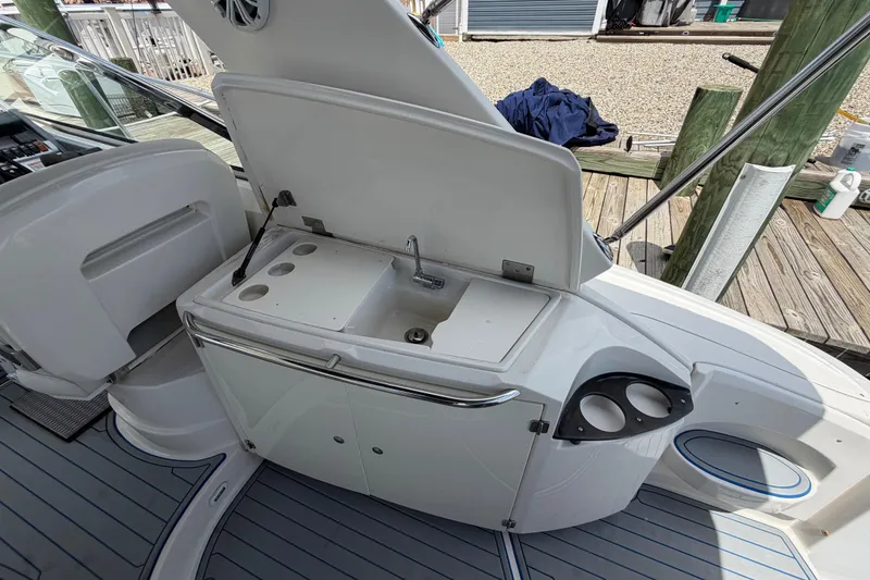 Slide: The Image of 2006 Monterey 350 Sport Yacht cockpit sink and storage area on deck. - 28
