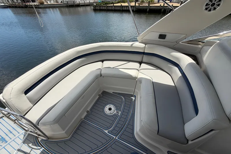 Slide: The Image of Luxury seating area on a 2006 Monterey 350 Sport Yacht by the water. - 29