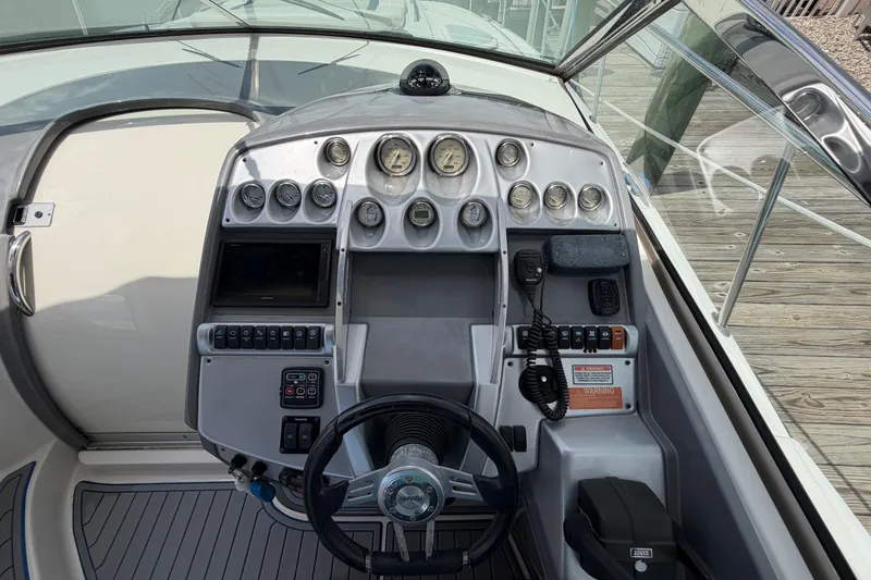 Slide: The Image of Cockpit of a 2006 Monterey 350 Sport Yacht with gauges and controls. - 30