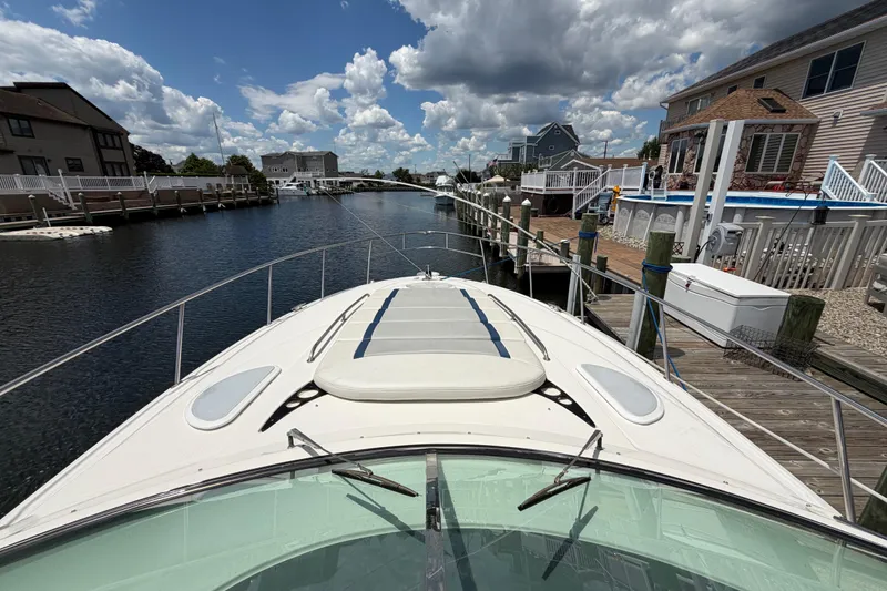Slide: The Image of 2006 Monterey 350 Sport Yacht docked in a scenic canal with cloudy sky. - 31