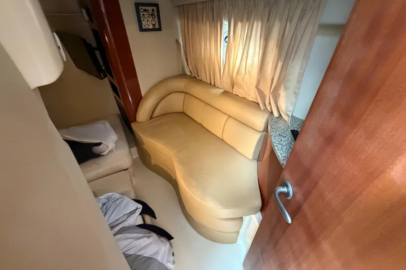Slide: The Image of Interior of 2006 Monterey 350 Sport Yacht with beige seating and curtains. - 38