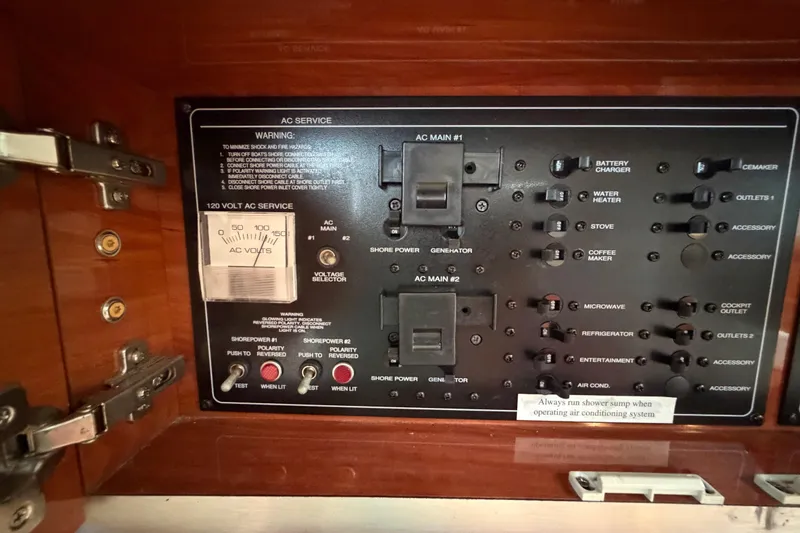 Slide: The Image of Electrical control panel on a 2006 Monterey 350 Sport Yacht, featuring various switches and indicators. - 40