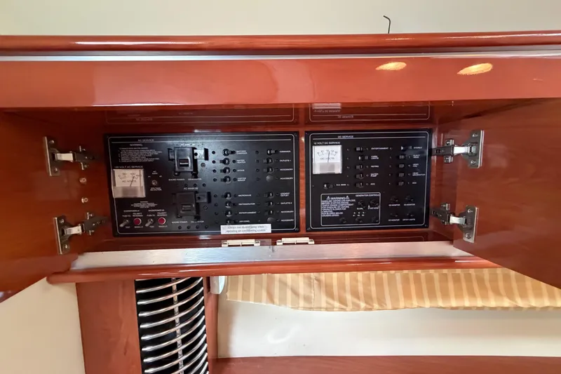 Slide: The Image of Electrical panel inside a 2006 Monterey 350 Sport Yacht, featuring switches and gauges. - 42