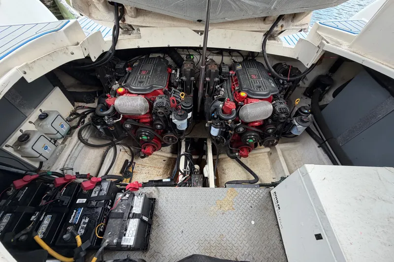Slide: The Image of Engine compartment of a 2006 Monterey 350 Sport Yacht, featuring dual engines and battery setup. - 43