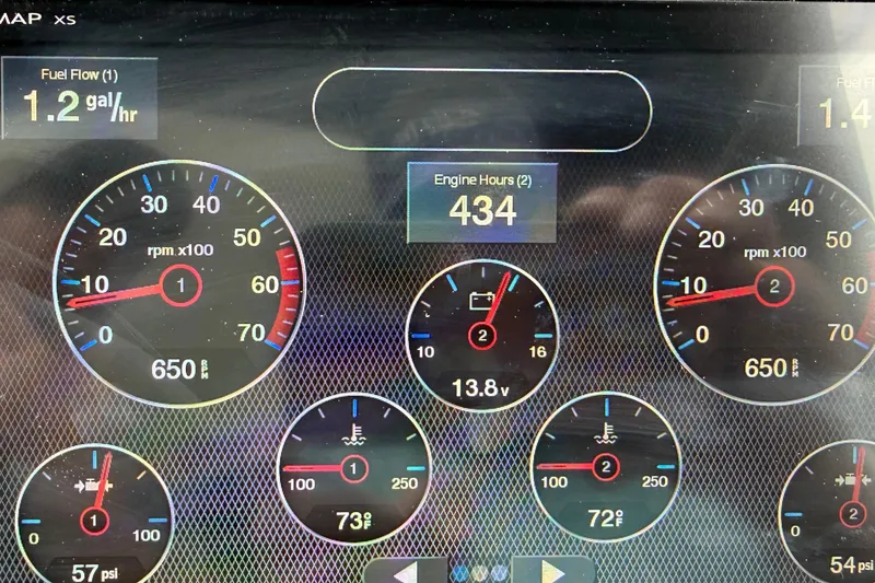 Slide: The Image of Dashboard of a 2006 Monterey 350 Sport Yacht showing engine metrics and fuel flow. - 45