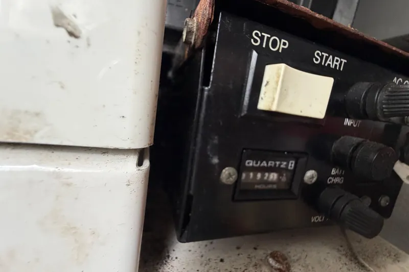 Slide: The Image of Control panel with start/stop buttons and dials on a 2006 Monterey 350 Sport Yacht. - 46