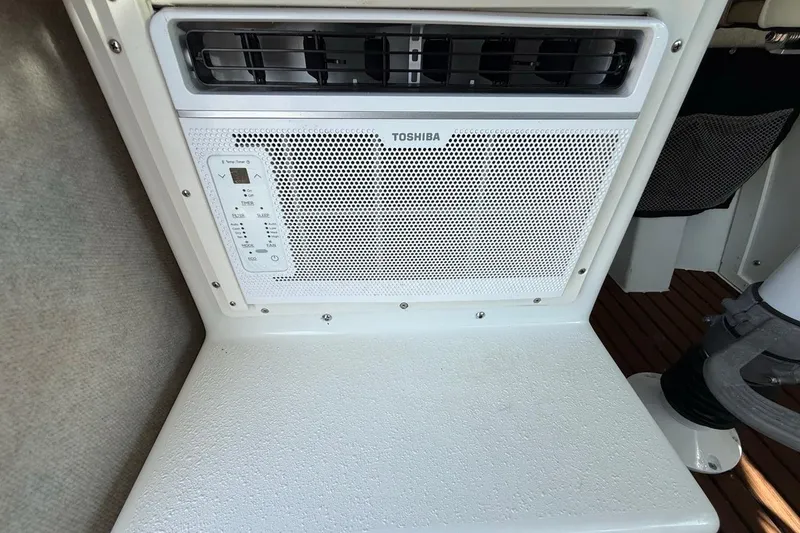 Slide: The Image of Toshiba air conditioning unit inside 2019 Parker 2520 XLD Sport Cabin boat. - 16