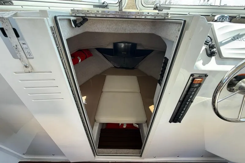 Slide: The Image of 2019 Parker 2520 XLD Sport Cabin interior with seating and control panel. - 18