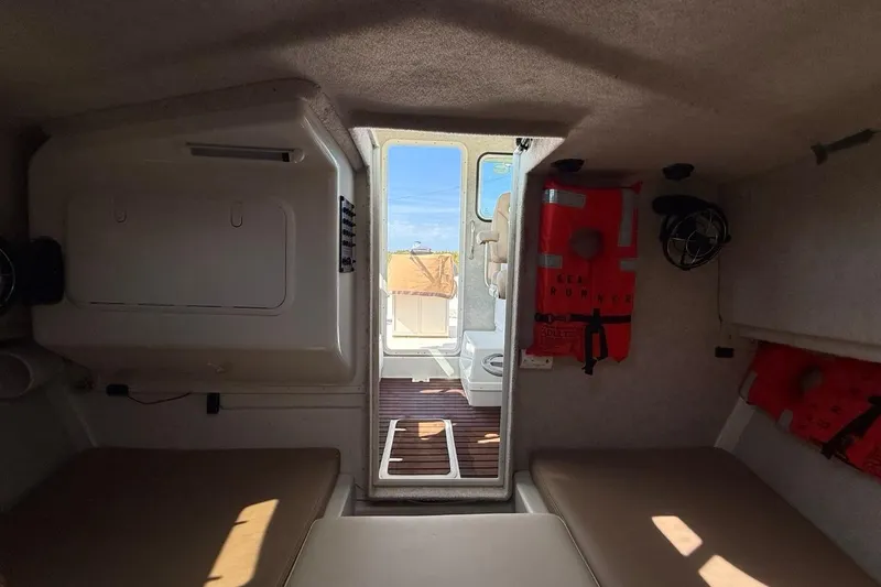 Slide: The Image of 2019 Parker 2520 XLD Sport Cabin interior with life jackets and seating. - 22