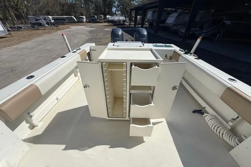 Slide: The Image of 2019 Parker 2520 XLD Sport Cabin boat interior with open storage compartments. - 33