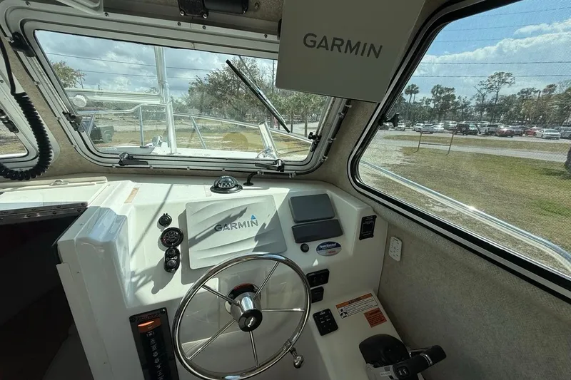 Slide: The Image of 2019 Parker 2520 XLD Sport Cabin interior with Garmin navigation system. - 7