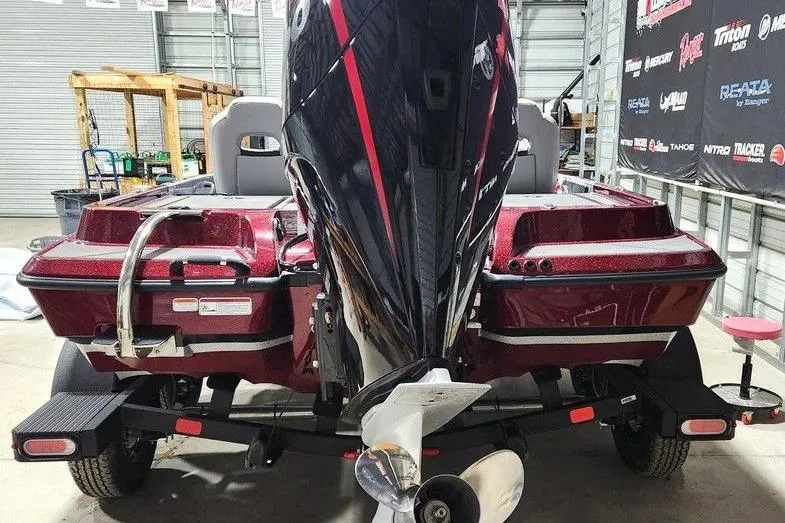 Slide: The Image of 2026 Nitro Z19 XL Pro boat in a garage, showcasing rear view and motor. - 1