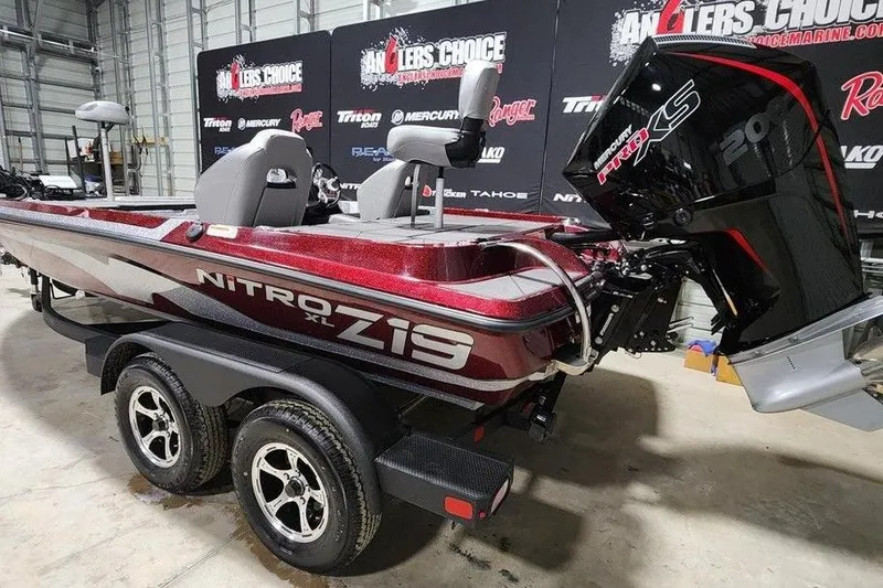 Slide: The Image of 2026 Nitro Z19 XL Pro boat with Mercury Pro XS engine in showroom. - 2