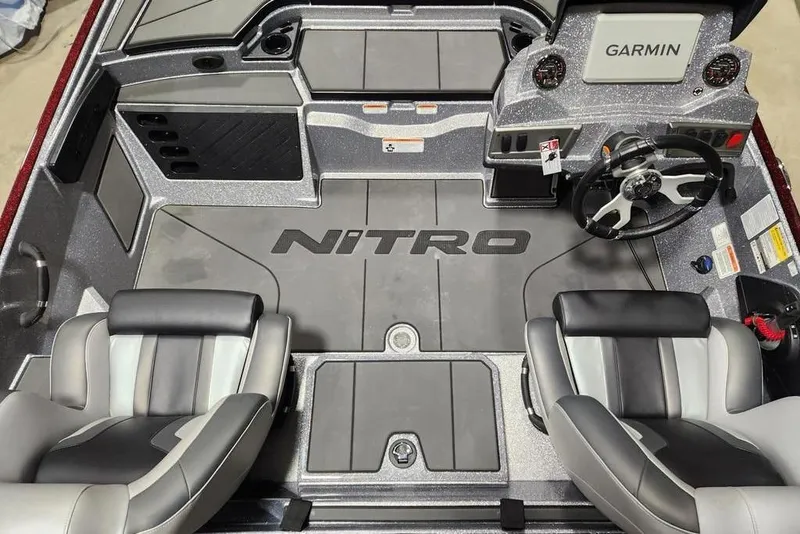 Slide: The Image of Interior of 2026 Nitro Z19 XL Pro boat with Garmin dashboard and seating. - 4