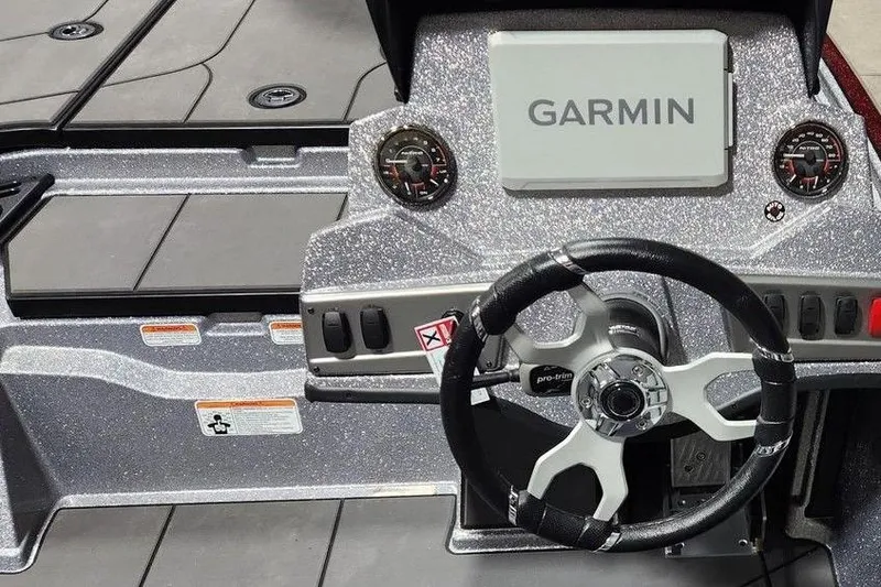 Slide: The Image of 2026 Nitro Z19 XL Pro boat dashboard with Garmin display and steering wheel. - 5