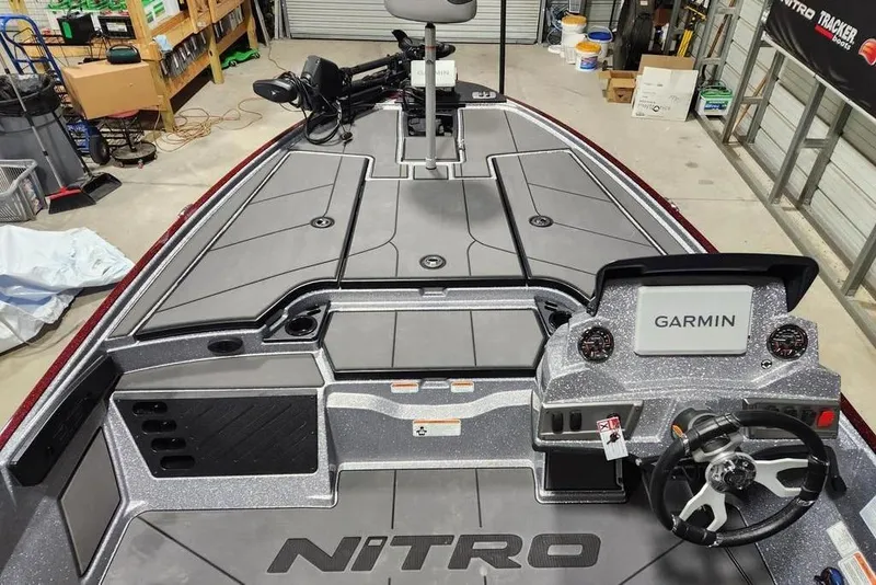 Slide: The Image of 2026 Nitro Z19 XL Pro boat interior with Garmin navigation system in a garage setting. - 8