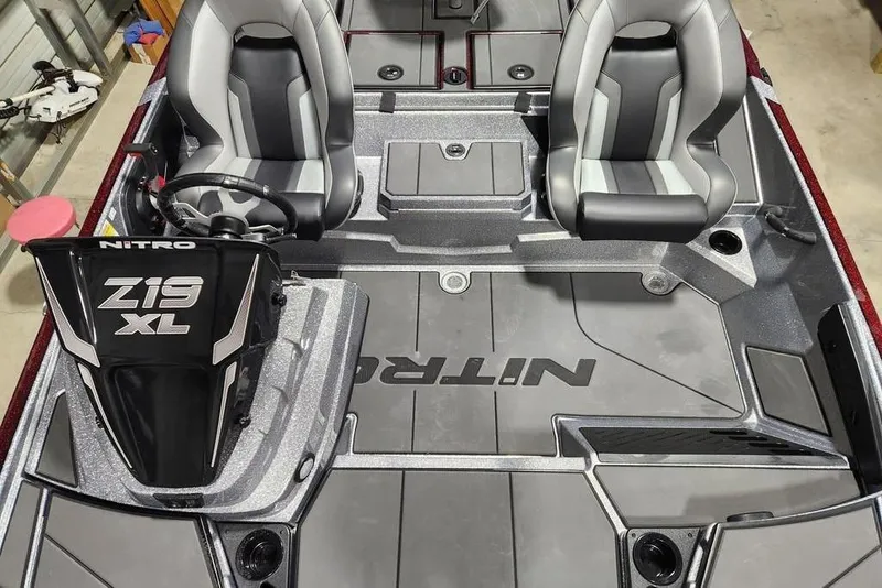 Slide: The Image of 2026 Nitro Z19 XL Pro boat interior with dual seats and steering console. - 9