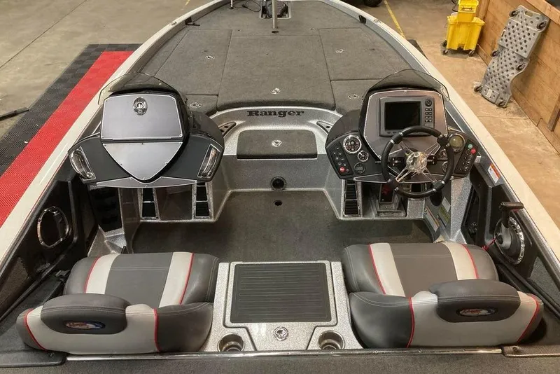 Slide: The Image of 2014 Ranger Z521 Comanche boat interior with dual seats and control panel. - 6