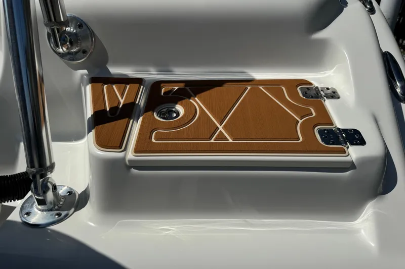 Slide: The Image of 2025 Key West 219 FS boat deck with teak finish and stainless steel fittings. - 10