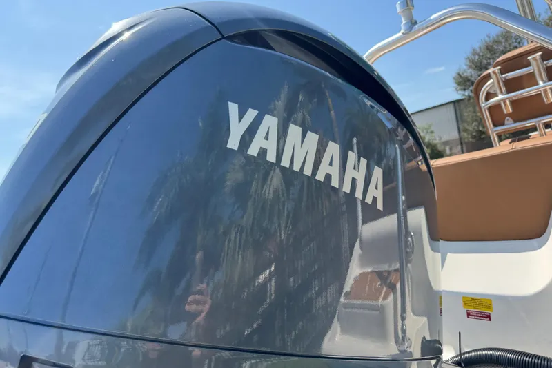 Slide: The Image of Yamaha engine on 2025 Key West 219 FS boat, sunny day reflection. - 12